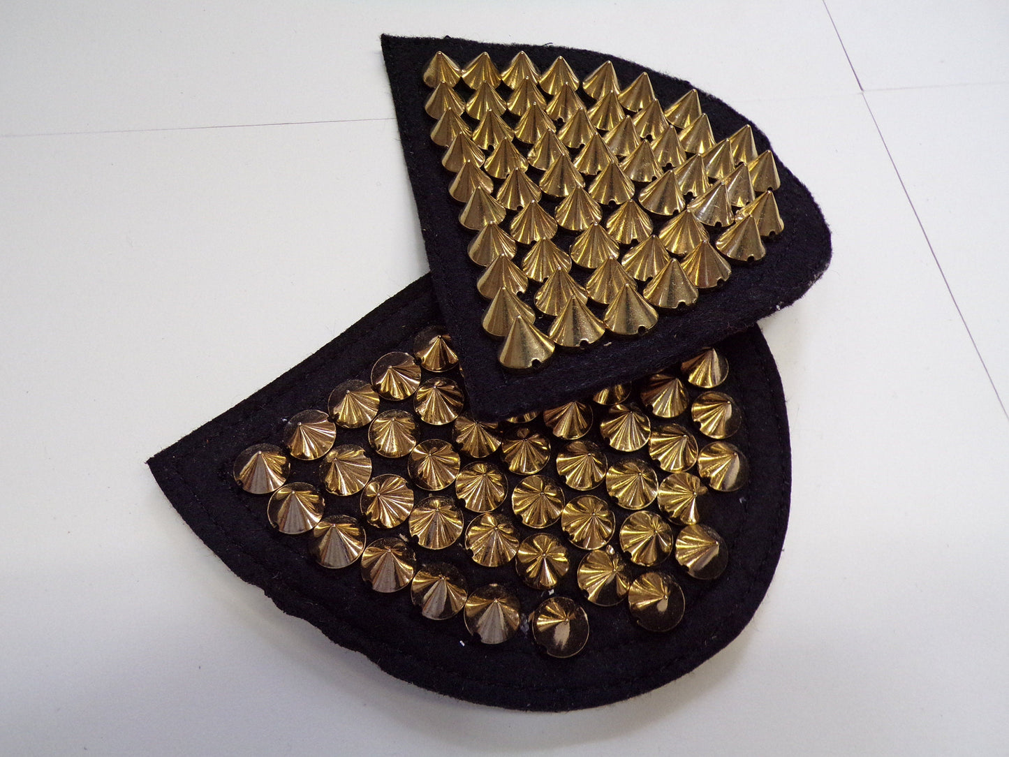 Epaulettes with studs in Gold sold as a pair. Spike gold stud trim, stud trim, shoulder stud trim