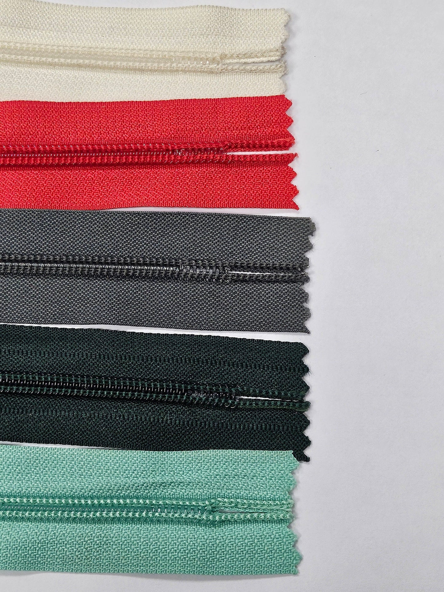 6" Closed ended zips, O-Ring Zips, metal ring/slider/puller, plastic teeth