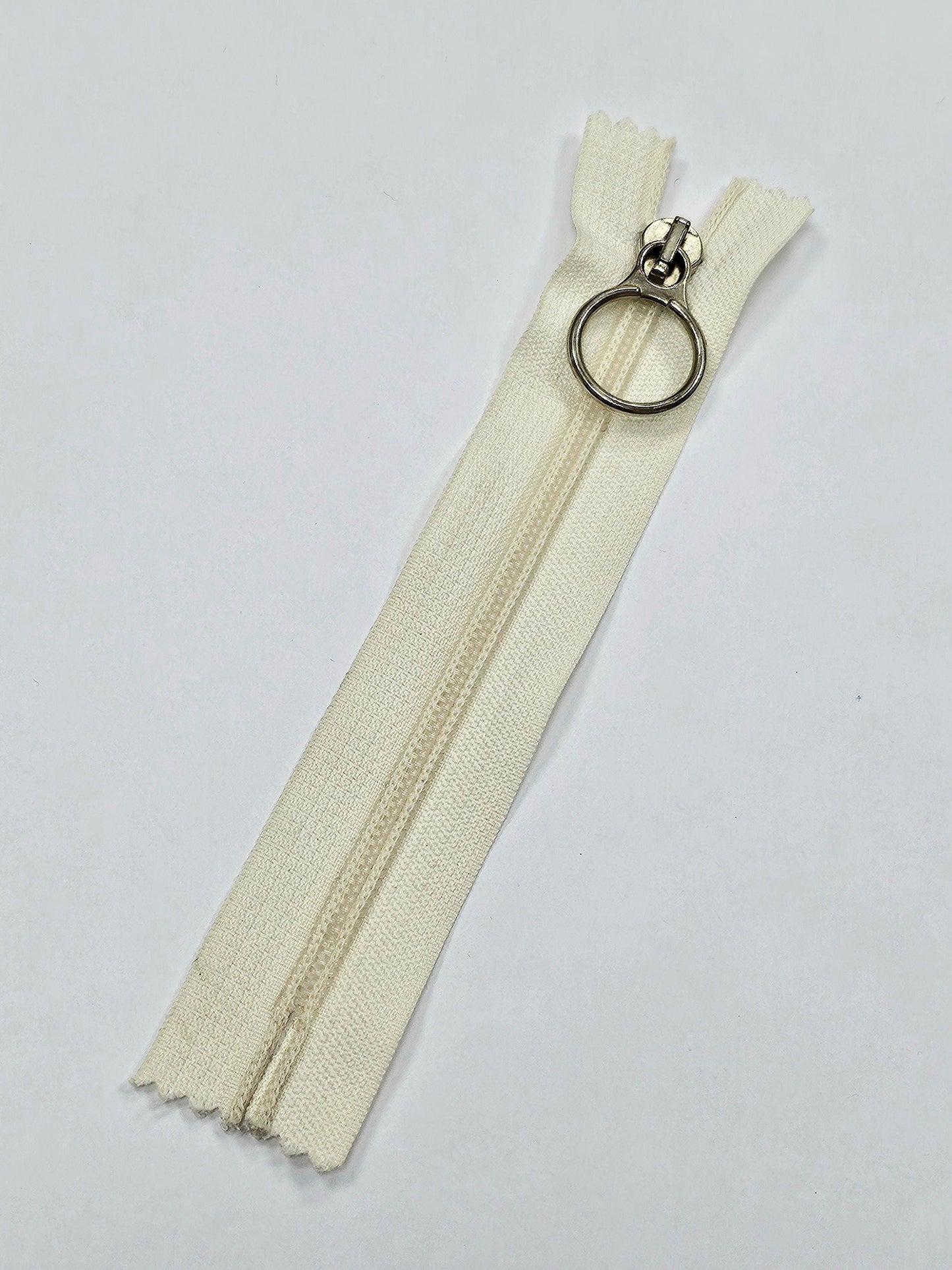 6" Closed ended zips, O-Ring Zips, metal ring/slider/puller, plastic teeth