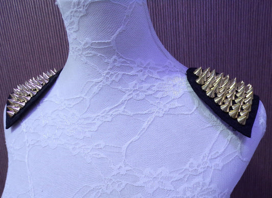 Epaulettes with studs in Gold sold as a pair. Spike gold stud trim, stud trim, shoulder stud trim