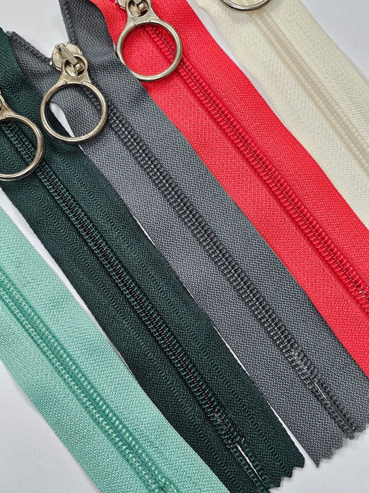 6" Closed ended zips, O-Ring Zips, metal ring/slider/puller, plastic teeth